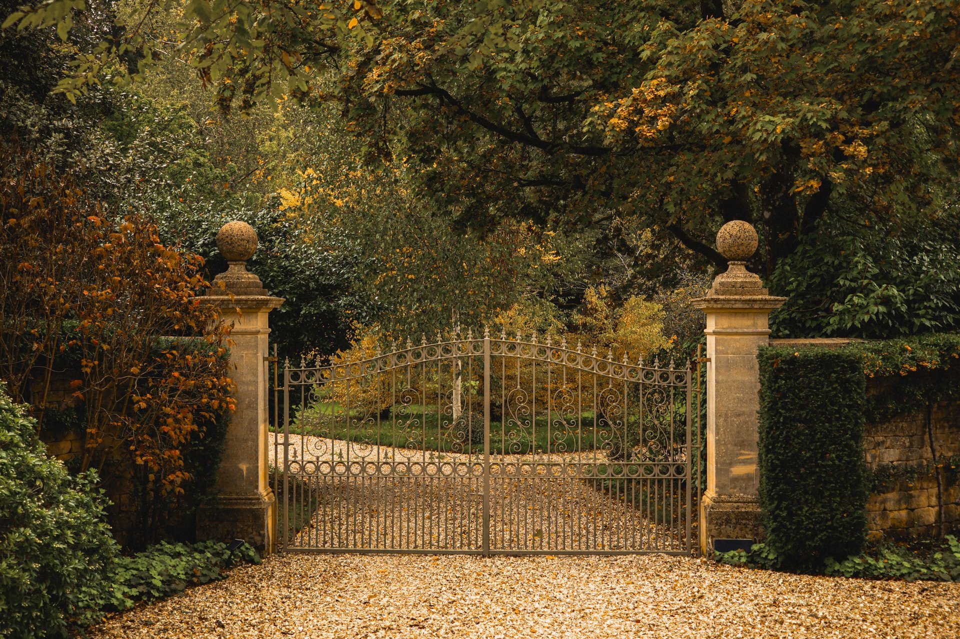 Grand estate gate with elegant fencing in beautiful countryside