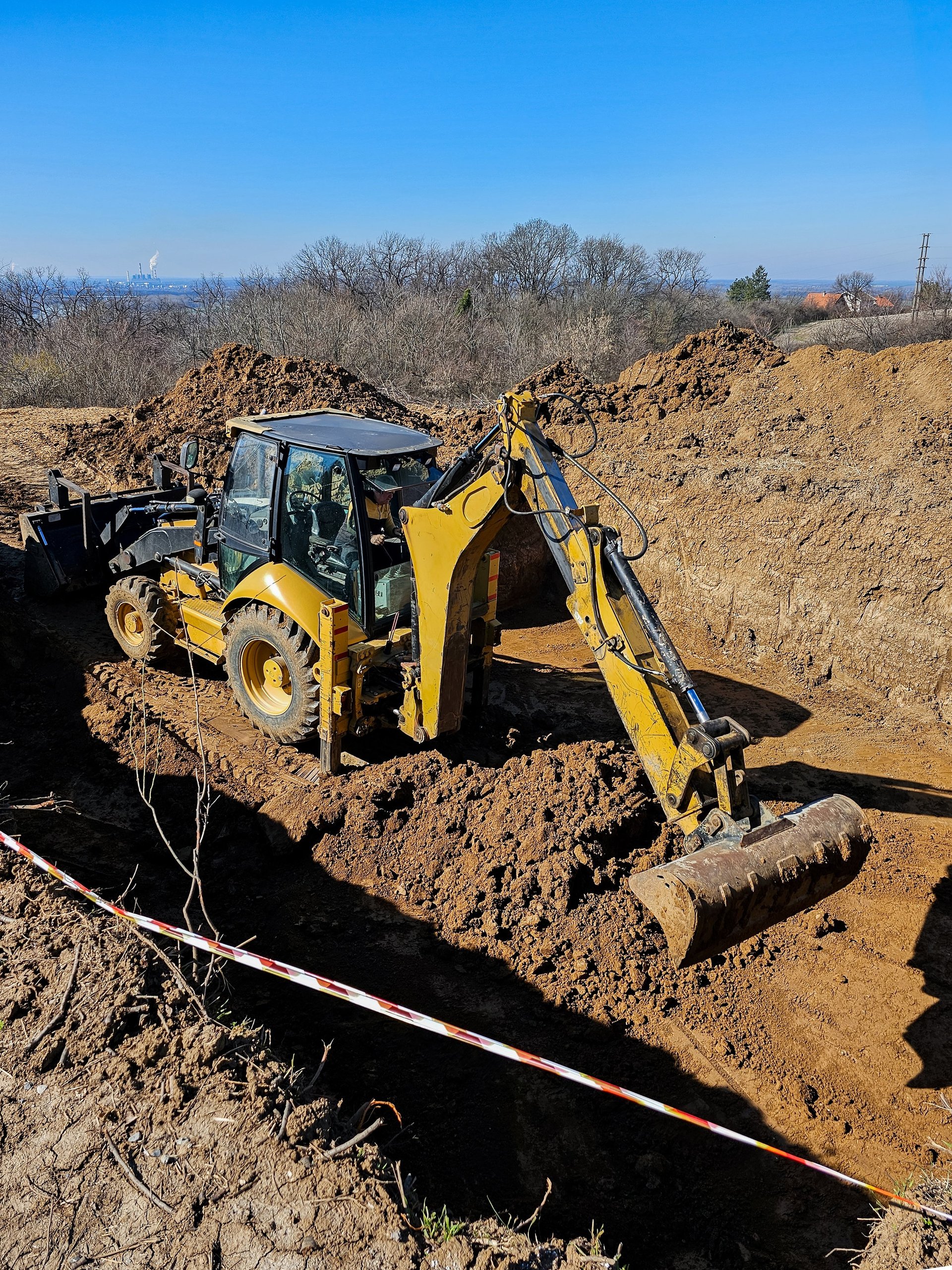 Professional backhoe excavator on construction site
